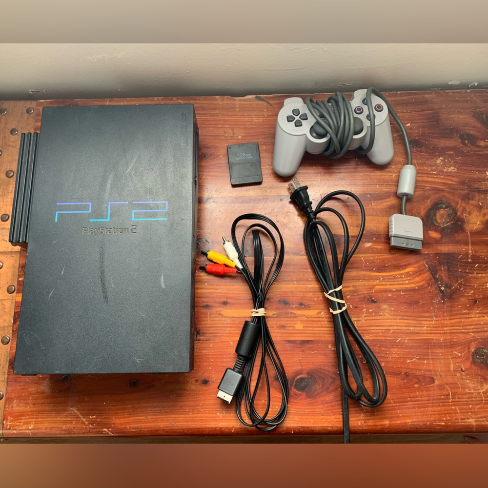 PlayStation2 with controller and memory card.